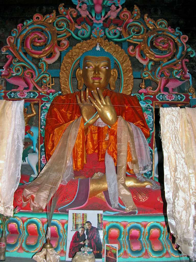 Annapurna 12 12 Braga Chorten Buddha Statue The Braga Gompa has a three-storied temple known as the Chorten. I waited outside and a monk unlocked the door to go in, so I followed him. Inside the temple was a large image of Buddha.